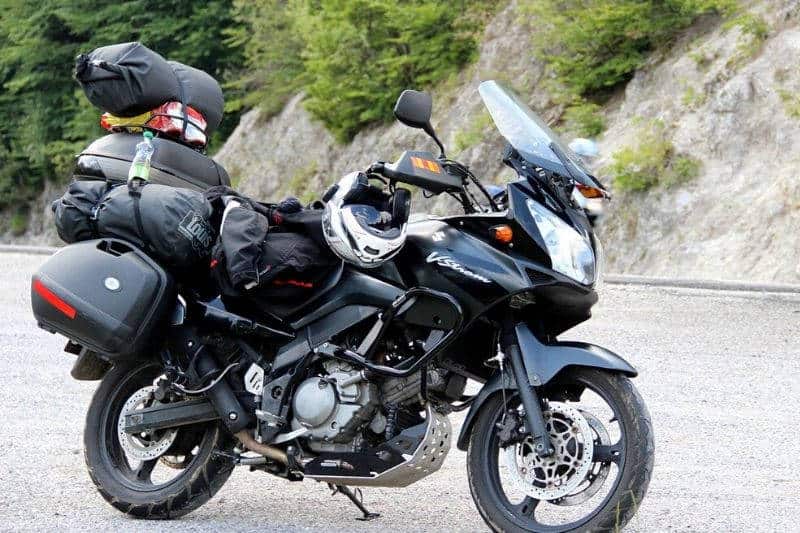 A motorcycle carrying a lot of weight.
