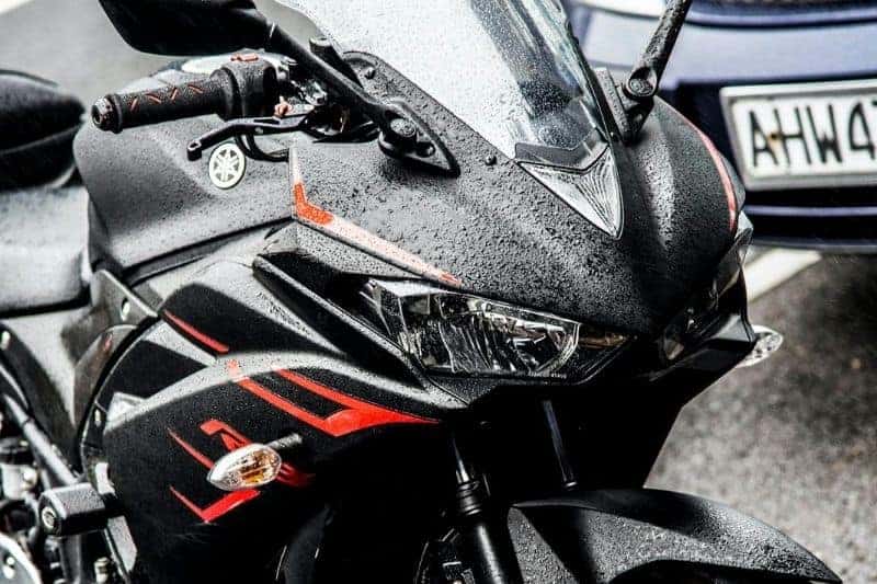 Will Rain Damage a Motorcycle? (What You Should Know) A motorcycle that has been left outside in the rain.