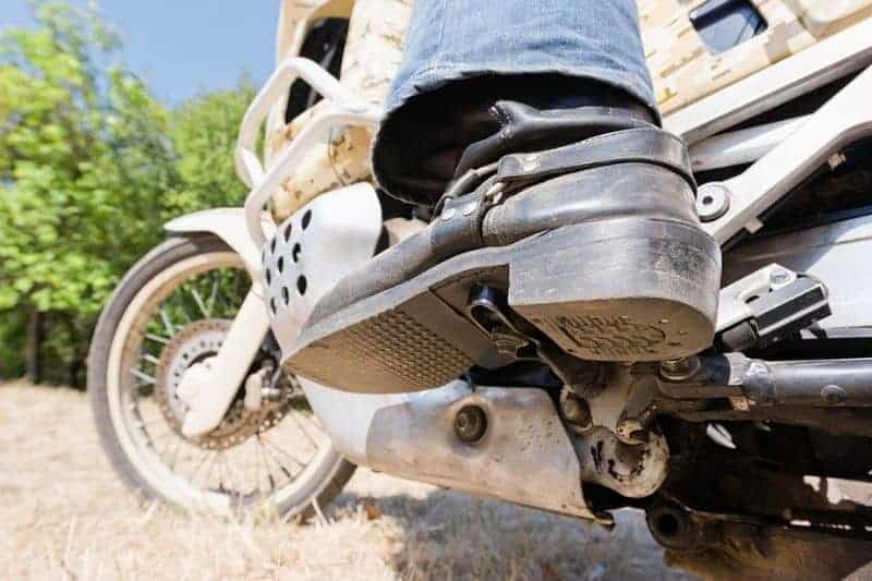 A motorcyclist with cowboy boots