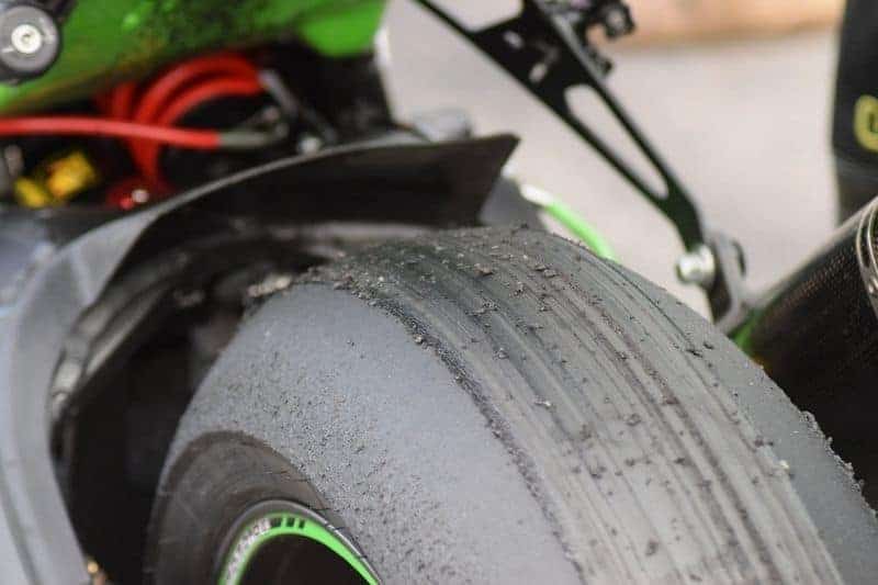 A rear motorcycle tire that has been severely worn out